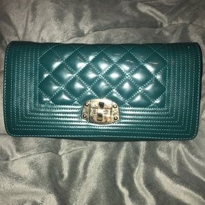 Pretty Turquoise clutch with a versatile strap!